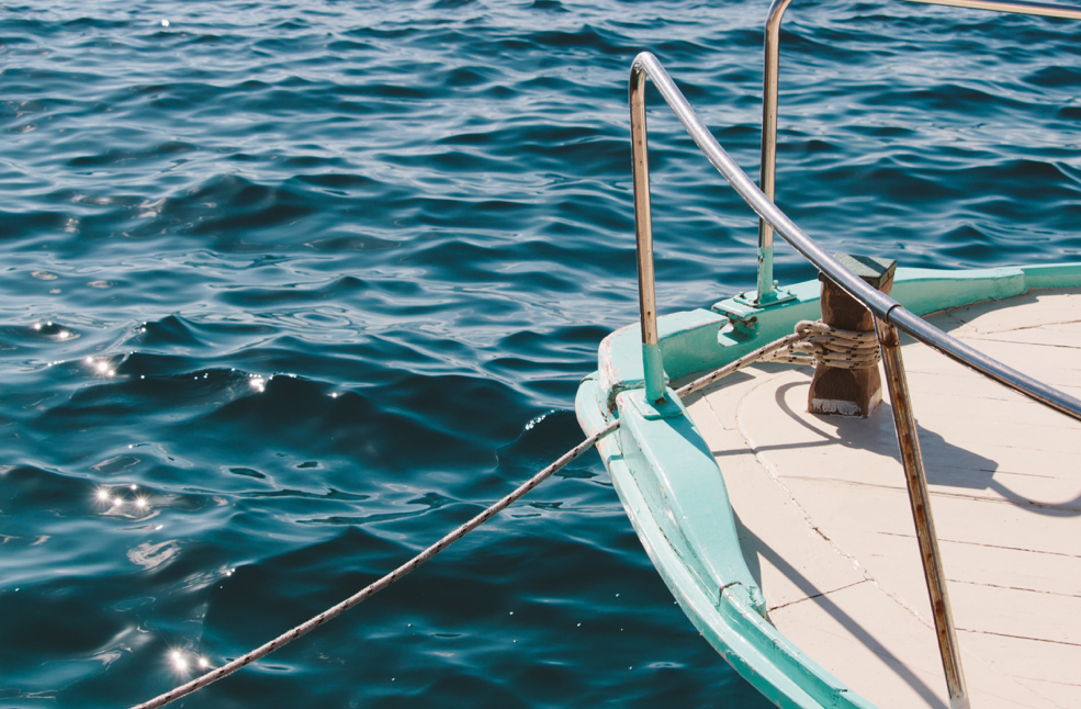 Sailboat tied up, floating in the water