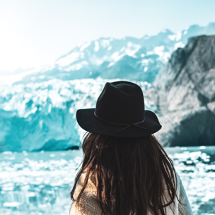 Woman staring out at a glacier